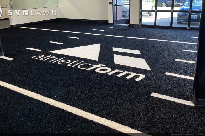 image of SYNLawn Fiji prefab turf logos for athletic weight room applications